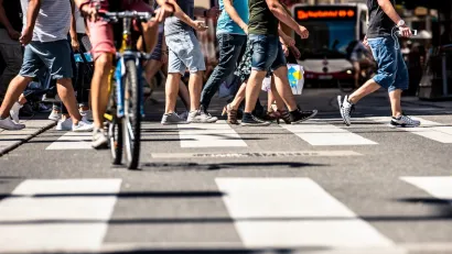 Low close-up of busy city crosswalk in Vienna, Austria.